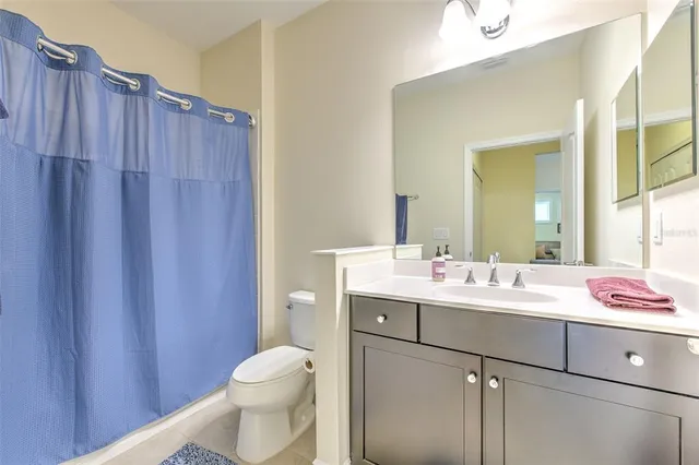 a kitchen with stainless steel appliances granite countertop sink stove and refrigerator