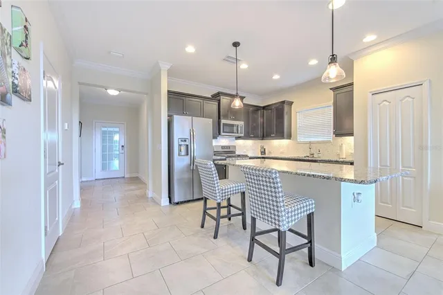 a bedroom with a large bed and a flat screen tv
