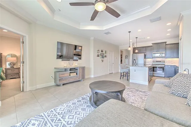 a green field with flowers and trees