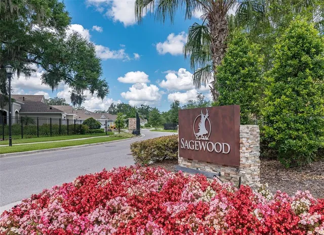 a view of swimming pool with a patio and lake view