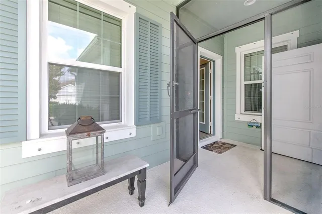an aerial view of a house with a yard and lake view