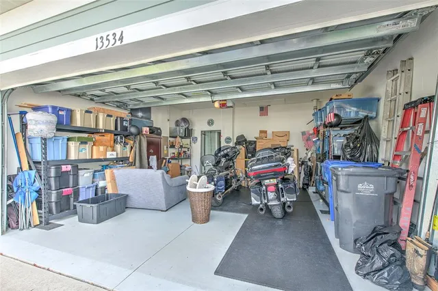 an aerial view of a house with garden space and lake view