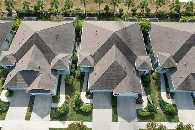 an aerial view of a residential houses with outdoor space
