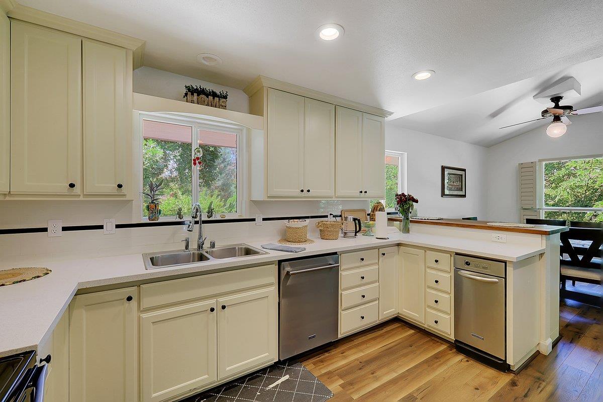 10307 Alta Mesa Road Wilton, CA 95693 - Photo 13 of 58 a kitchen with a sink cabinets and window