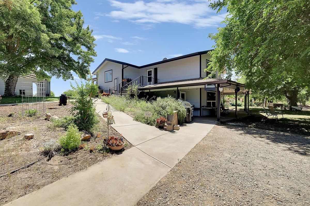 10307 Alta Mesa Road Wilton, CA 95693 - Photo 2 of 58 front view of a house with a yard