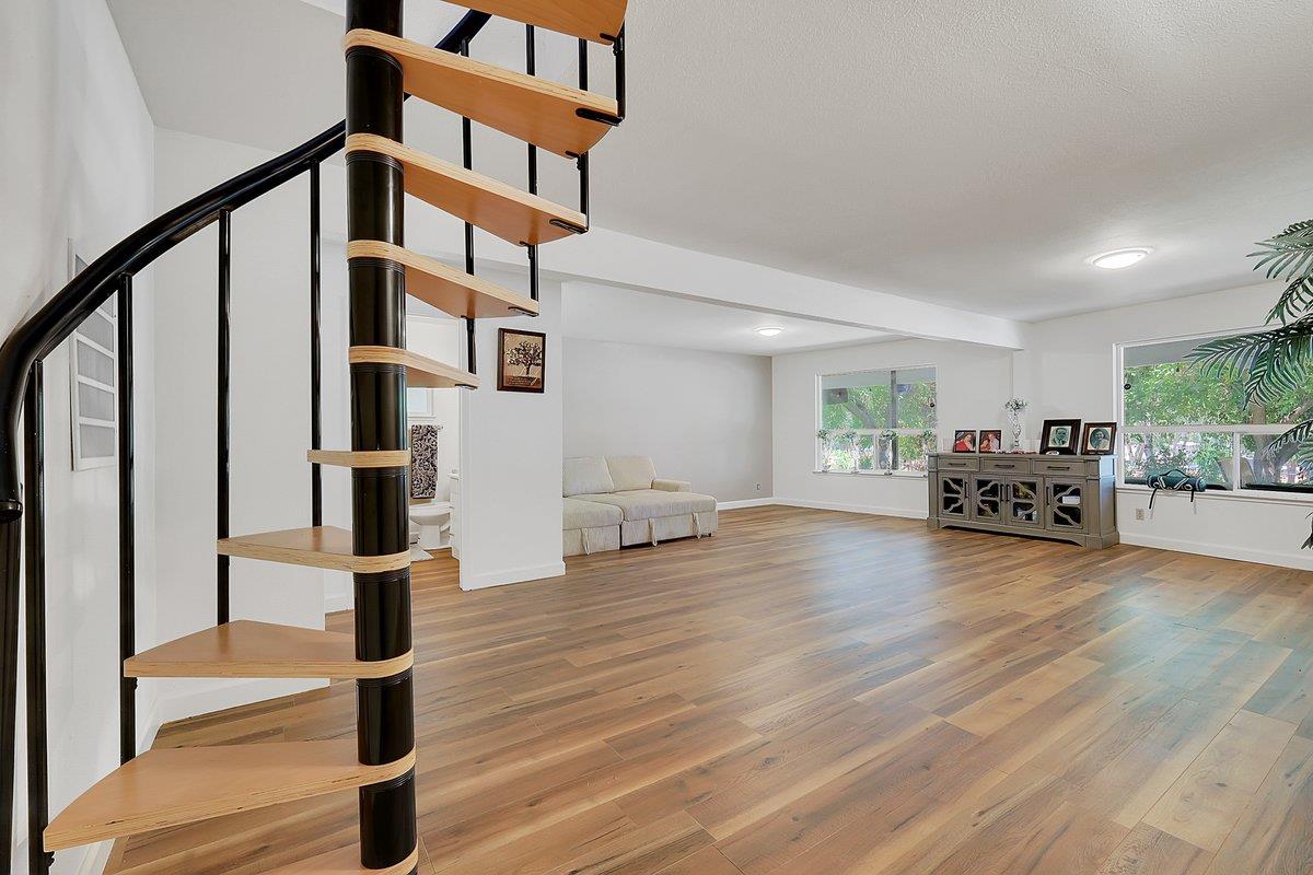 10307 Alta Mesa Road Wilton, CA 95693 - Photo 28 of 58 a view of a livingroom with furniture and an entryway with wooden floor
