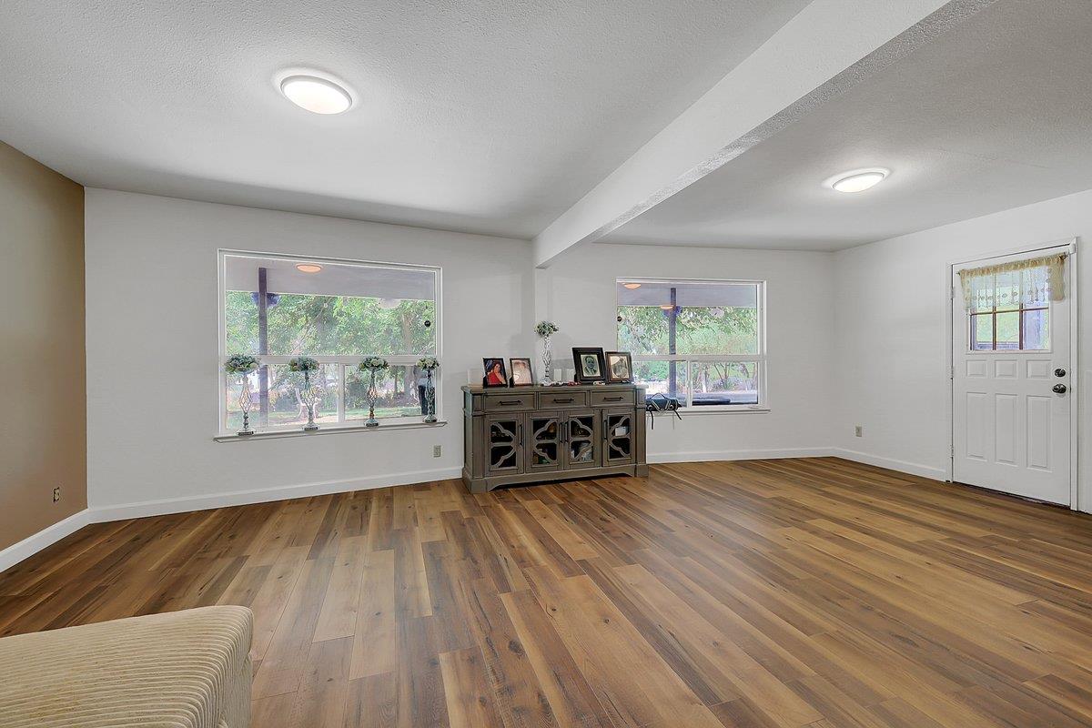 10307 Alta Mesa Road Wilton, CA 95693 - Photo 31 of 58 a living room with hard wood floors and a window