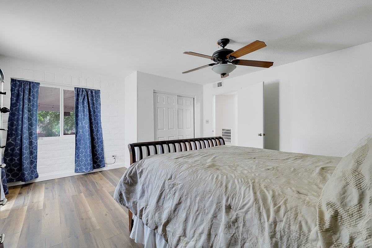 10307 Alta Mesa Road Wilton, CA 95693 - Photo 34 of 58 a bed sitting in a bedroom next to a window