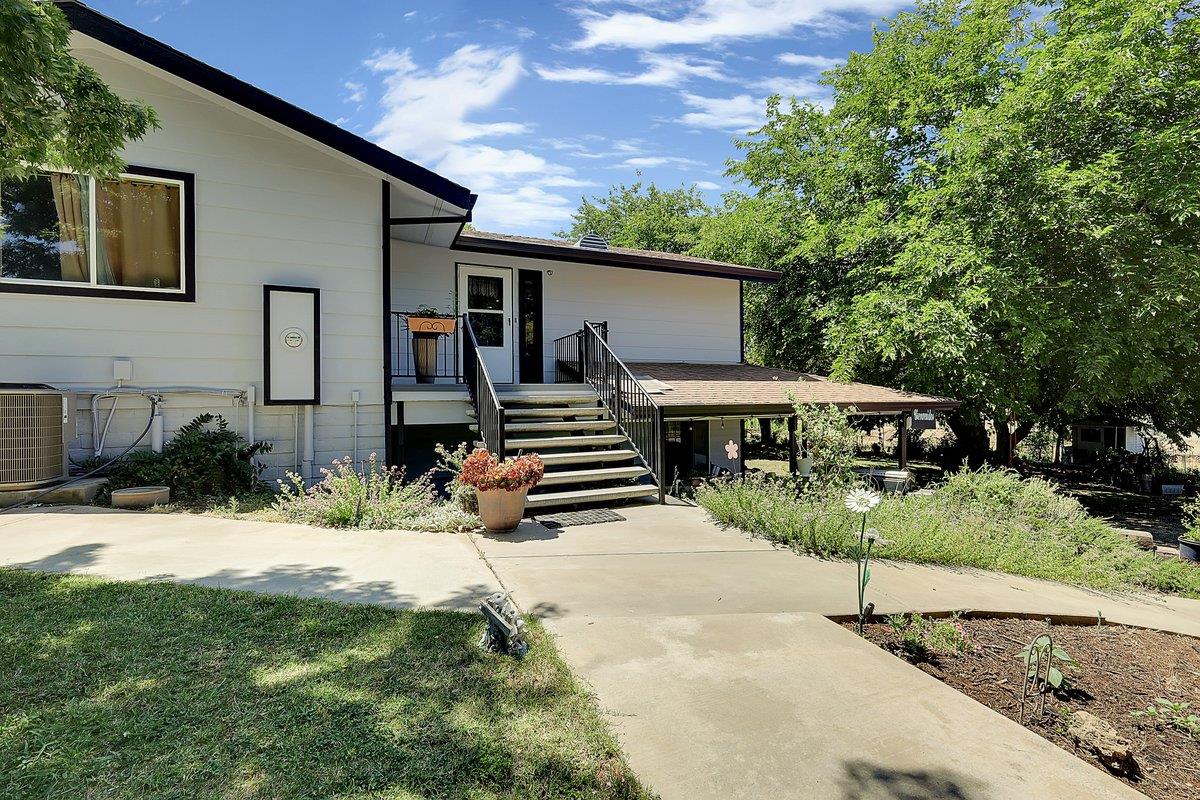 10307 Alta Mesa Road Wilton, CA 95693 - Photo 4 of 58 a front view of a house with a yard