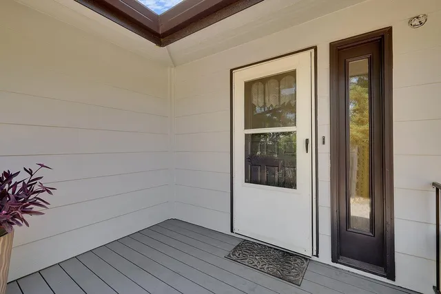 a living room with furniture and flowers