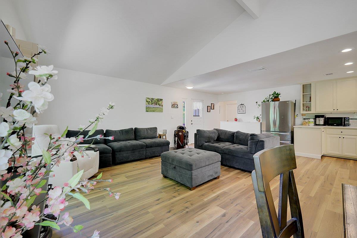10307 Alta Mesa Road Wilton, CA 95693 - Photo 6 of 58 a living room with furniture and flowers