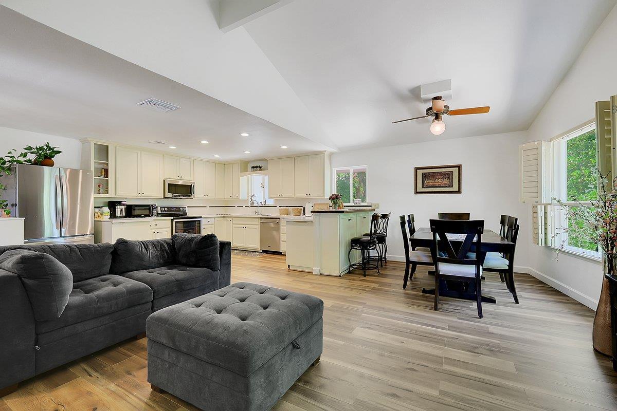 10307 Alta Mesa Road Wilton, CA 95693 - Photo 7 of 58 a living room with furniture and kitchen view