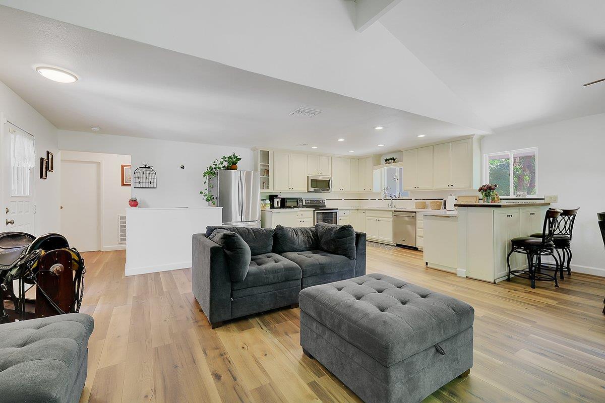 10307 Alta Mesa Road Wilton, CA 95693 - Photo 8 of 58 a living room with furniture and a dining table with kitchen view