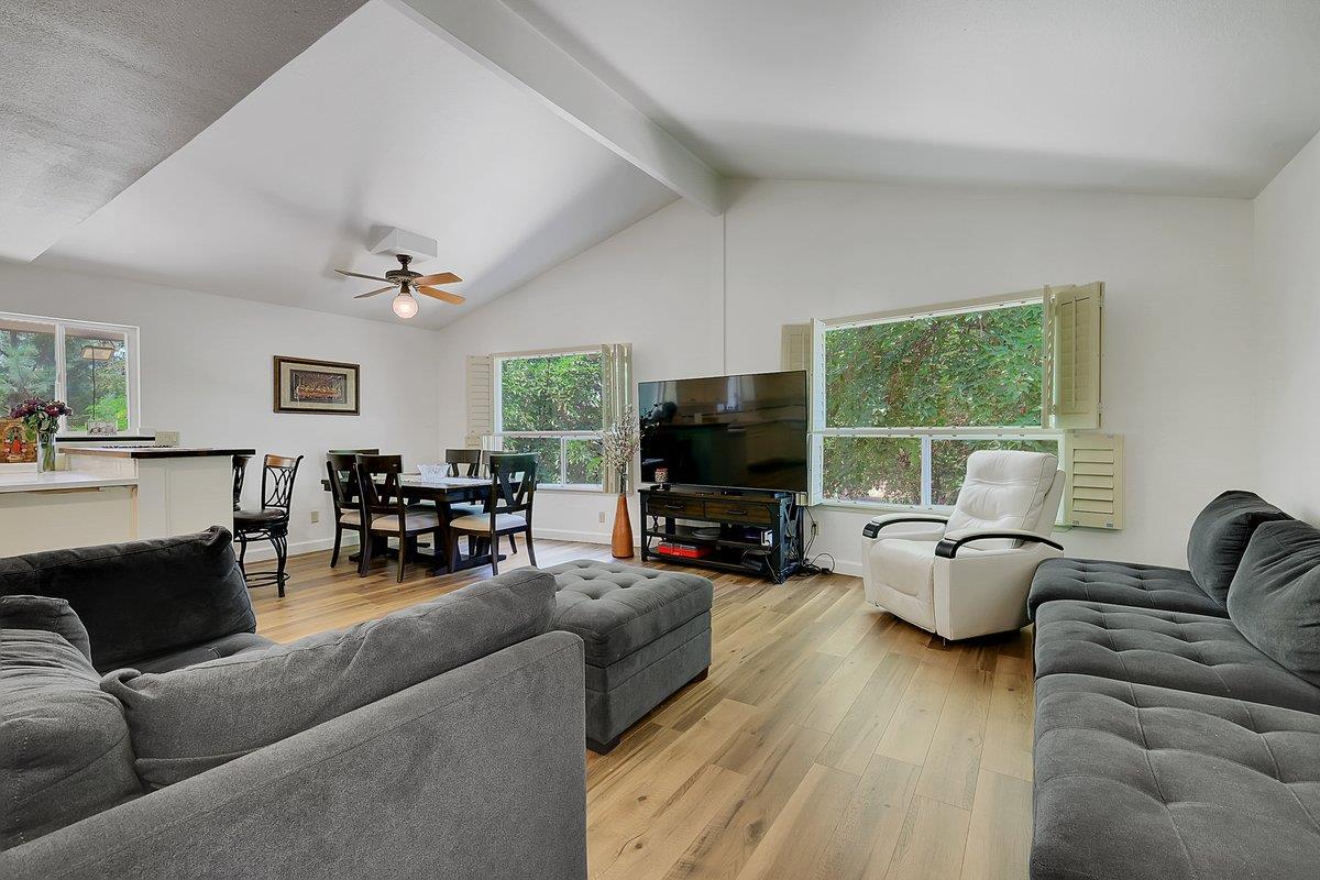 10307 Alta Mesa Road Wilton, CA 95693 - Photo 9 of 58 a living room with furniture and a flat screen tv