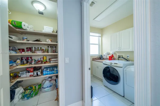 a storage room with washer and dryer