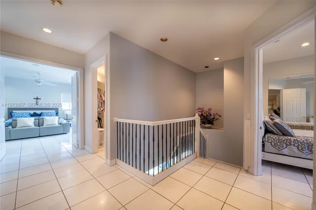 a view of a bedroom with furniture and windows