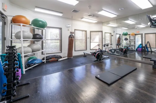 a view of swimming pool with palm trees