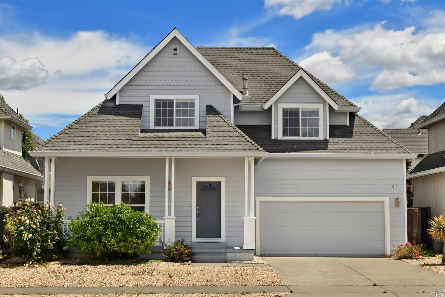 front view of a house with a yard