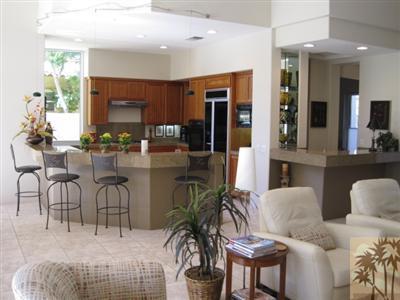 304 Loch Lomond Road Rancho Mirage, CA 92270 - Photo 1 of 17 a living room with furniture a potted plant and a large window