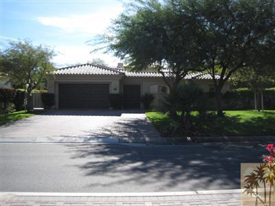 304 Loch Lomond Road Rancho Mirage, CA 92270 - Photo 11 of 17 a front view of a house with a yard