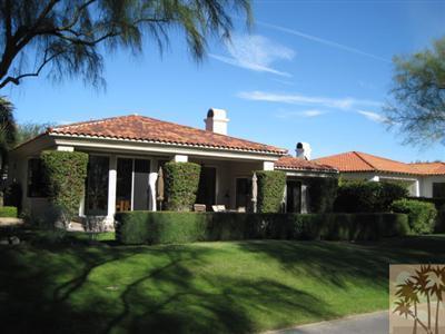 304 Loch Lomond Road Rancho Mirage, CA 92270 - Photo 12 of 17 a front view of a house with a garden