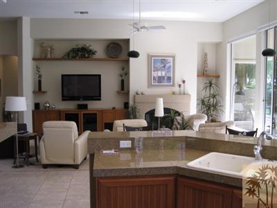 304 Loch Lomond Road Rancho Mirage, CA 92270 - Photo 5 of 17 a kitchen with stainless steel appliances granite countertop a sink and a refrigerator