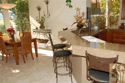 304 Loch Lomond Road Rancho Mirage, CA 92270 - Photo 6 of 17 a table and chairs in a patio of the house