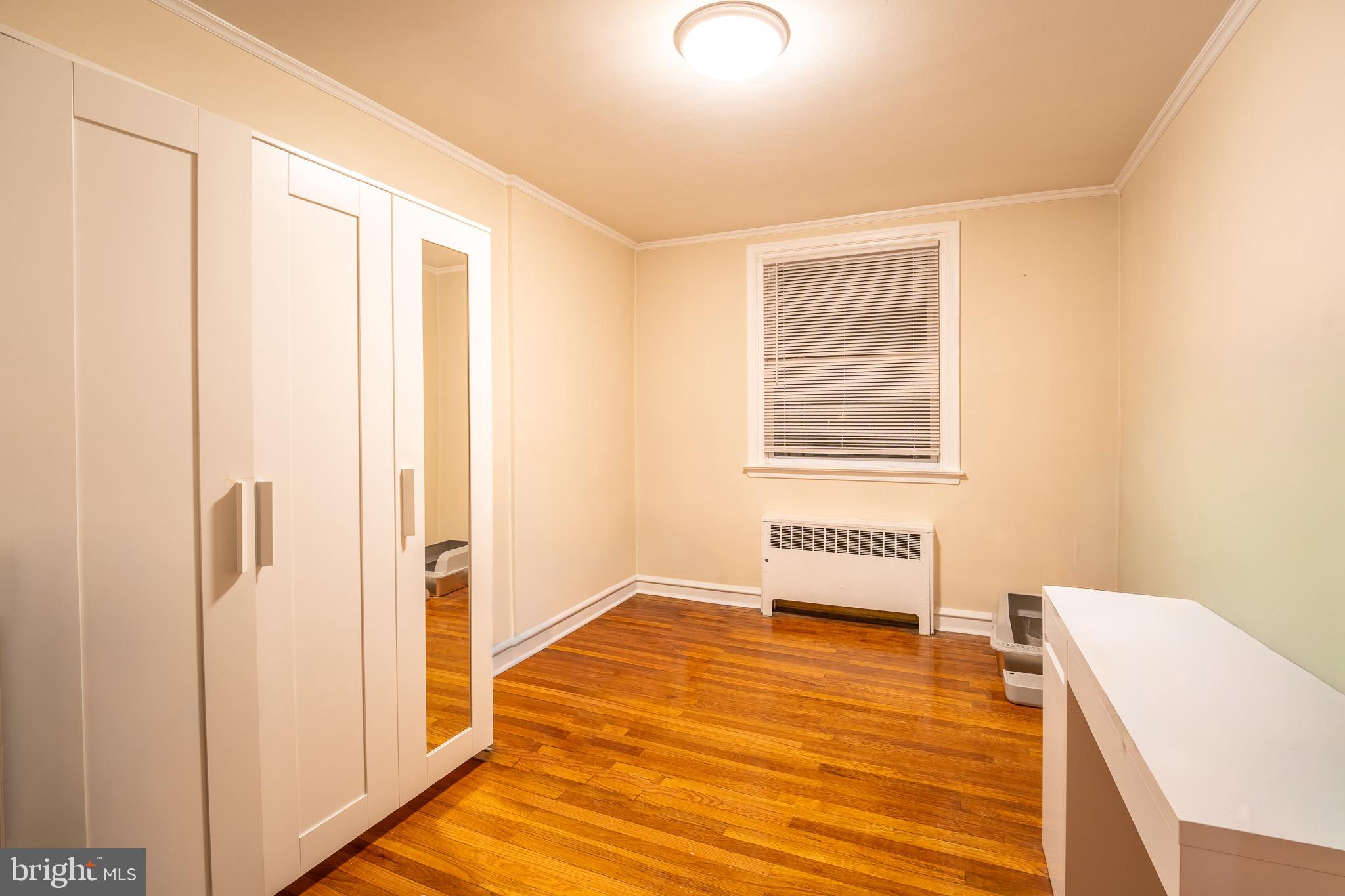 8207 Williams Avenue Philadelphia, PA 19150 - Photo 12 of 21 a bedroom with a bed and a window