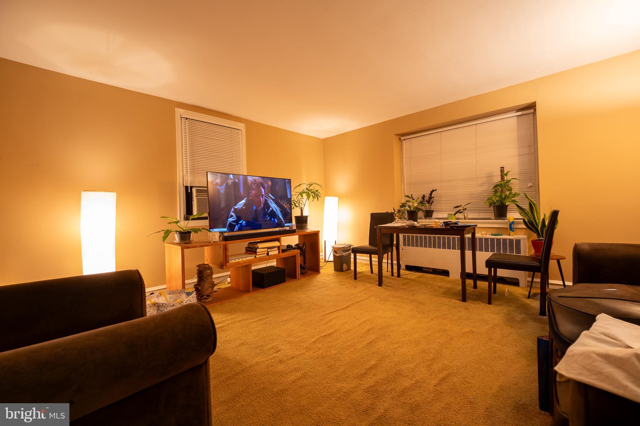 8207 Williams Avenue Philadelphia, PA 19150 - Photo 14 of 21 a living room with furniture and a flat screen tv