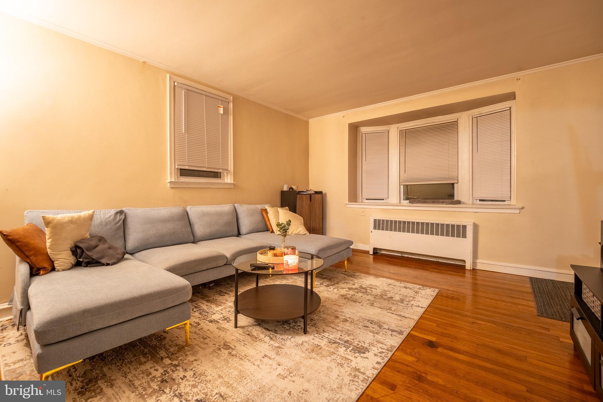 8207 Williams Avenue Philadelphia, PA 19150 - Photo 2 of 21 a living room with furniture and a wooden floor