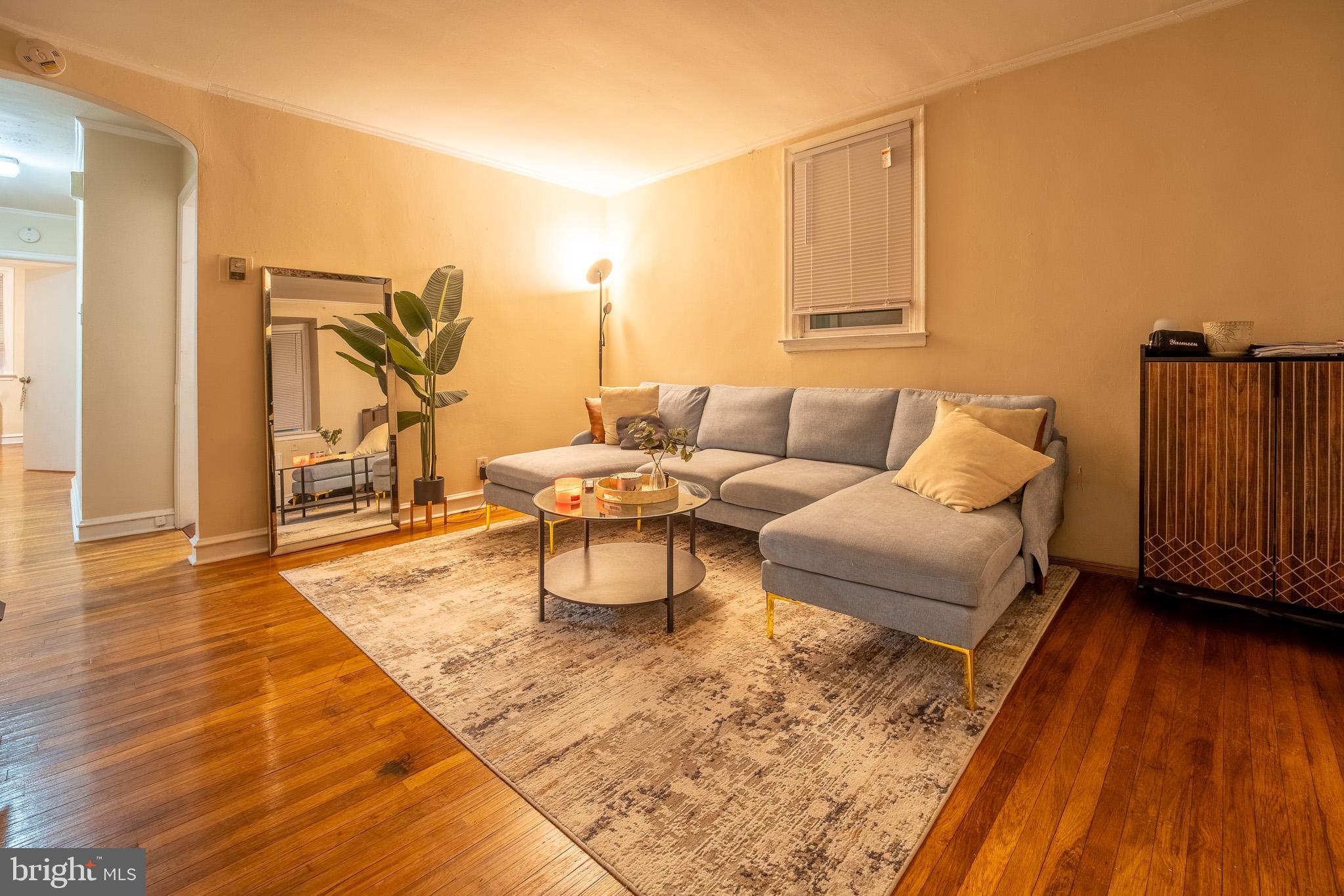 8207 Williams Avenue Philadelphia, PA 19150 - Photo 3 of 21 a living room with furniture and wooden floor