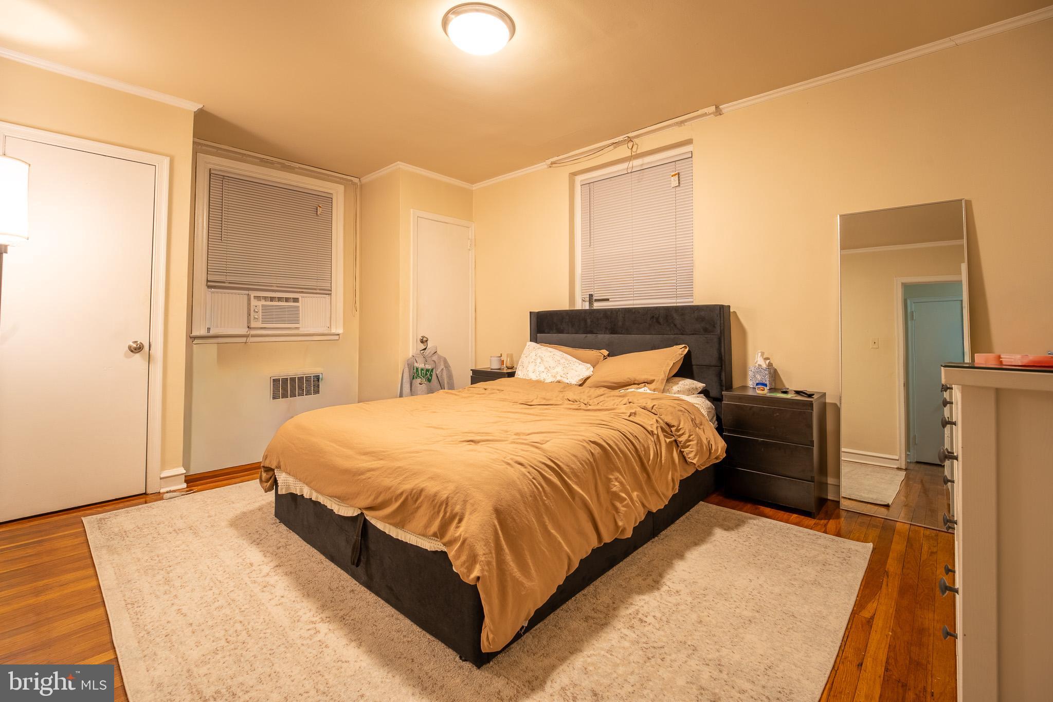 8207 Williams Avenue Philadelphia, PA 19150 - Photo 10 of 21 a bedroom with a bed and a table