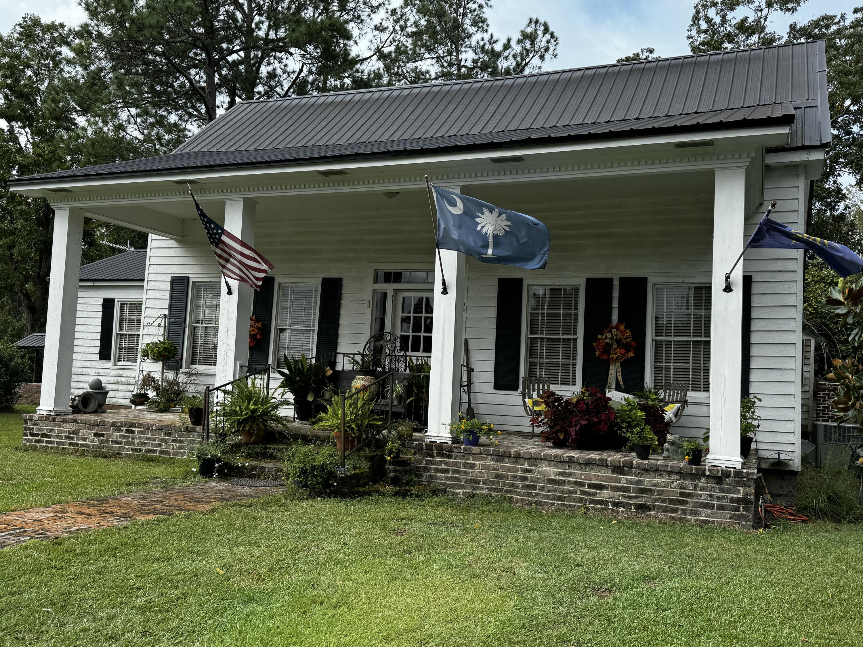 106 County Rd S-18-134 Reevesville, SC 29471 - Photo 6 of 37 Right front Church Street flags waving