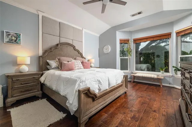 a bedroom with a bed and a night stand