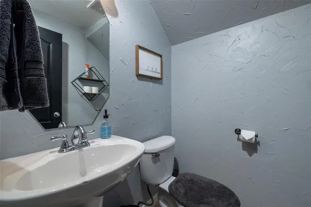 a bathroom with a sink and a toilet