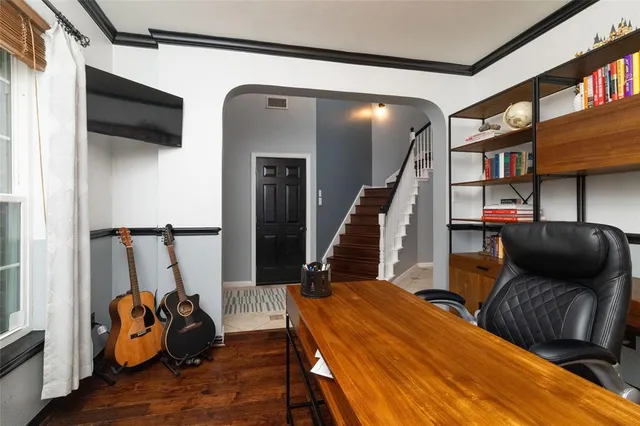 a bedroom with furniture and a window
