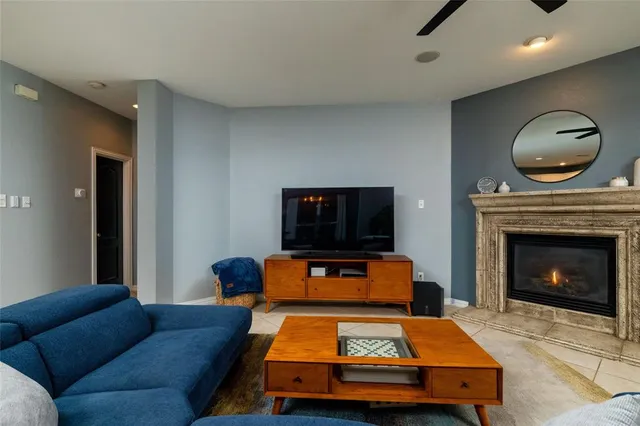 a bedroom with furniture and a fireplace