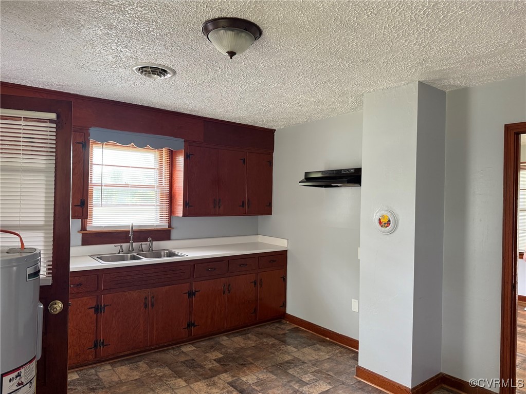 1252 Columbia Road Columbia, VA 23038 - Photo 15 of 41 Kitchen with water heater, a sink, light counterto