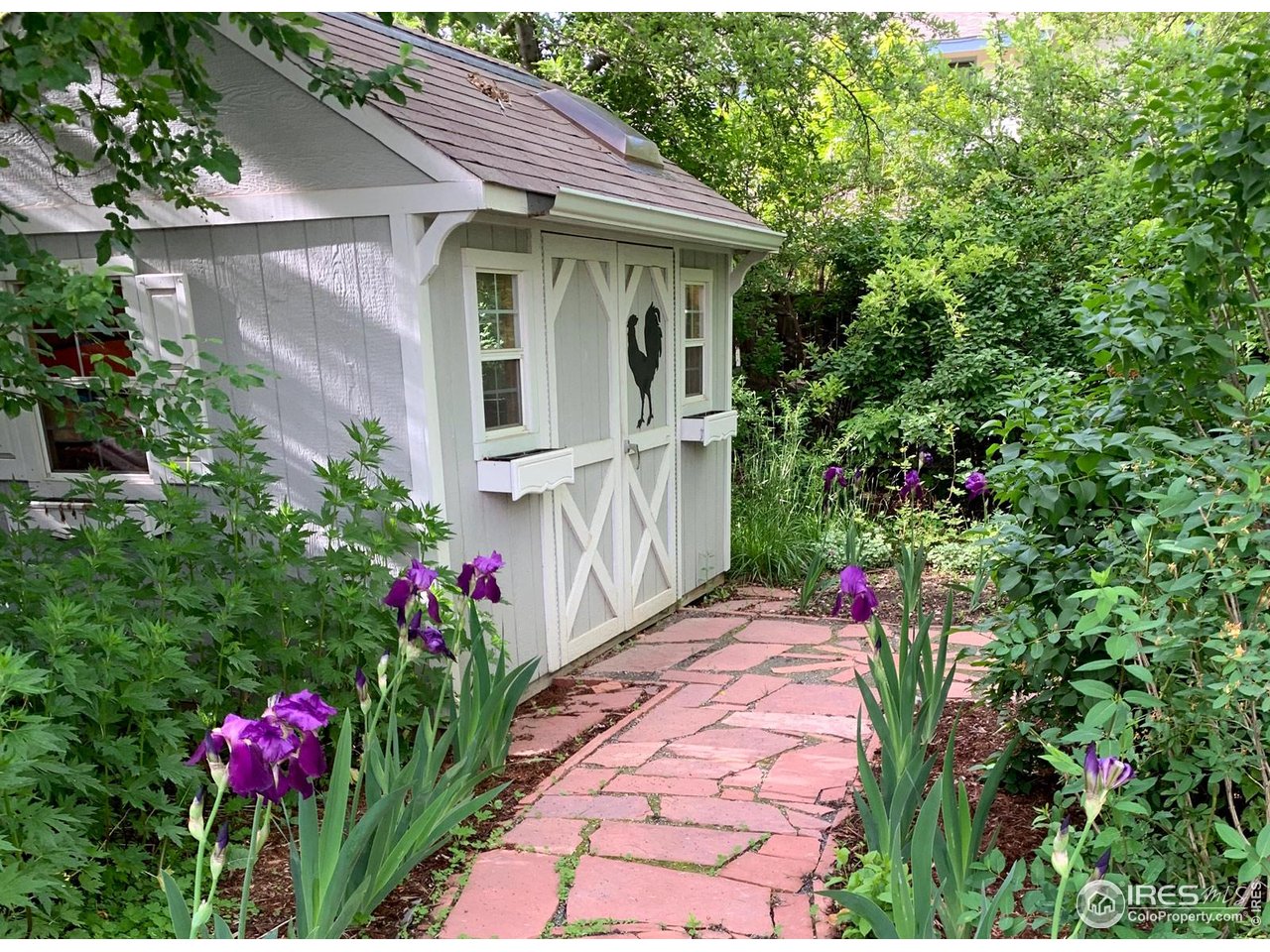 4556 Apple Way Boulder, CO 80301 - Photo 19 of 50 Spring view of Shed/Playhouse in SE corner of yard