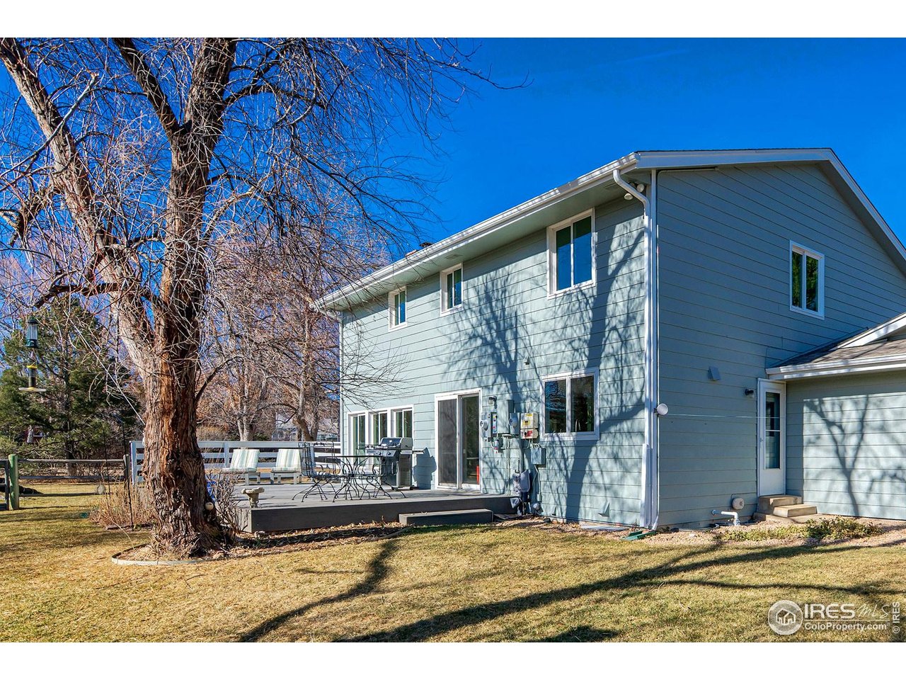 4556 Apple Way Boulder, CO 80301 - Photo 20 of 50 View of the house and deck from the SE portion of the .57 acre lot