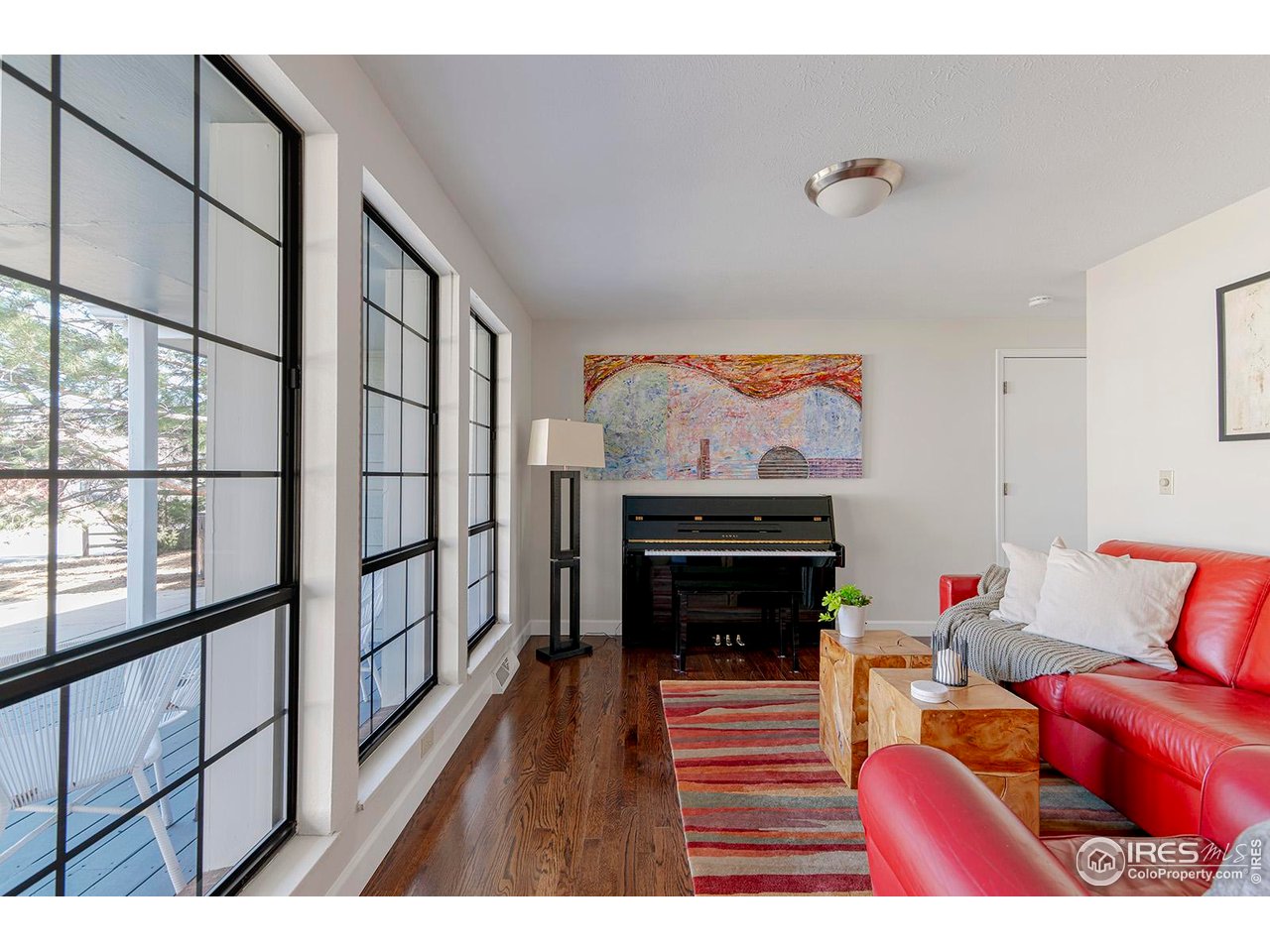 4556 Apple Way Boulder, CO 80301 - Photo 24 of 50 Music room is another flexible space that can be used as office, playroom, art studio with wall of black framed window overlooking front porch and front yard