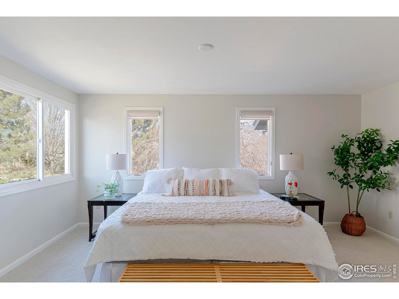 4556 Apple Way Boulder, CO 80301 - Photo 29 of 50 Spacious primary bedroom suite has windows facing 3 directions: north, west and south