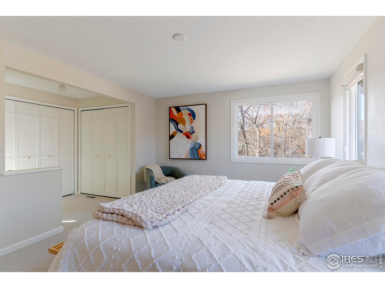 4556 Apple Way Boulder, CO 80301 - Photo 30 of 50 Primary suite with dressing area and double closets and vanity. Freshly painted with brand new carpet