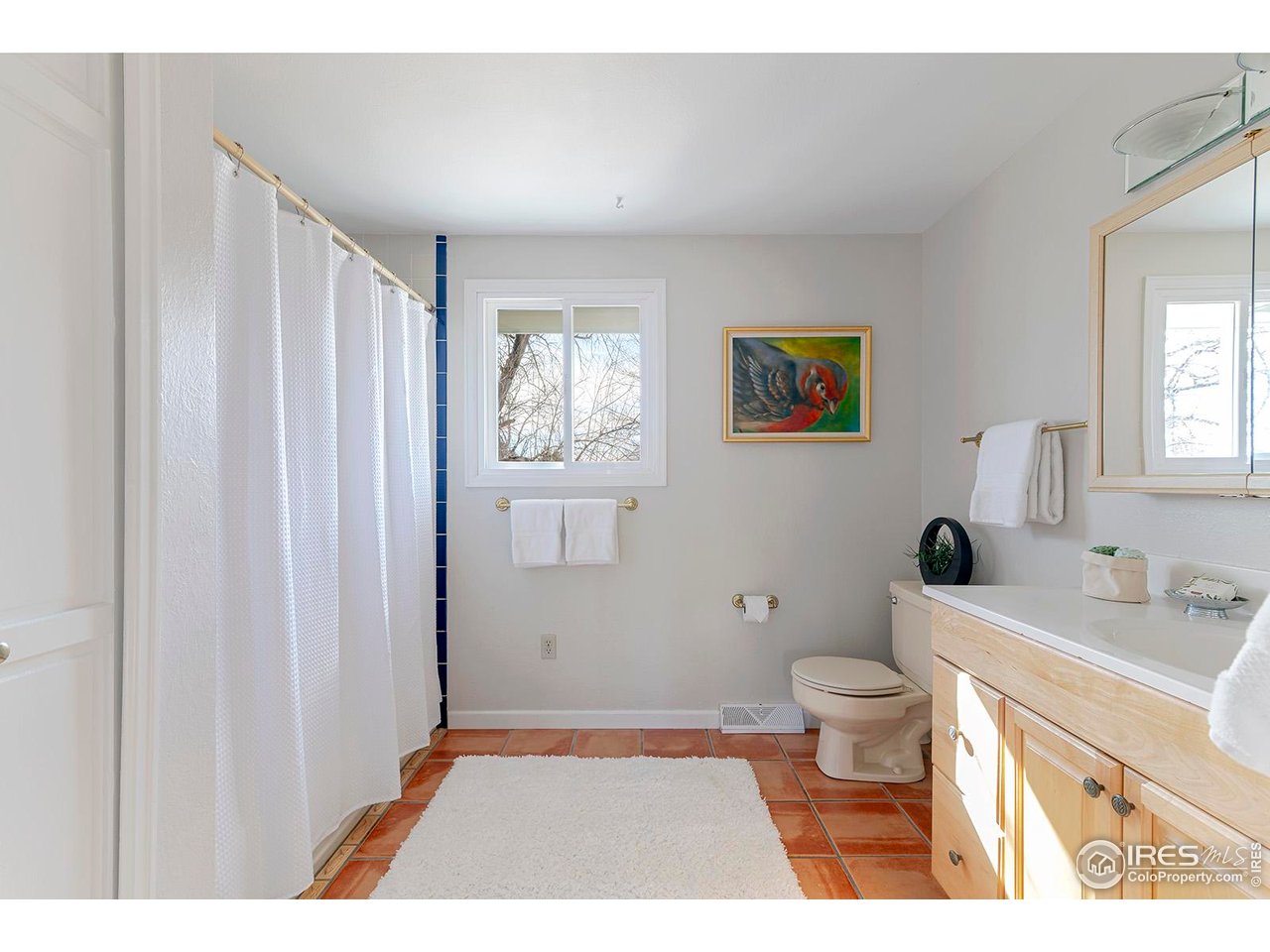 4556 Apple Way Boulder, CO 80301 - Photo 37 of 50 Shared bathroom facing south with tub/shower, stone tile floors and large vanity