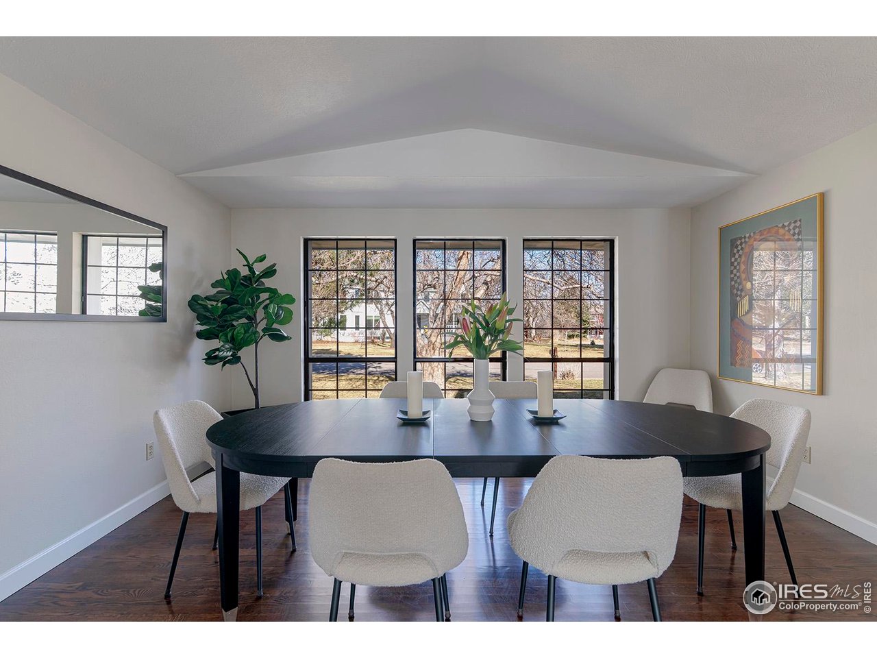 4556 Apple Way Boulder, CO 80301 - Photo 5 of 50 Dining room with wall of charming black frame windows facing the large front yard