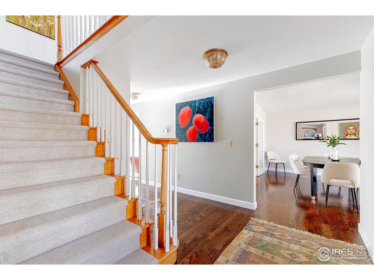 4556 Apple Way Boulder, CO 80301 - Photo 10 of 50 Gracious entry flowing to dining room to the west and music room to the east with stairs to access the upper level. Brand new carpet on stairs