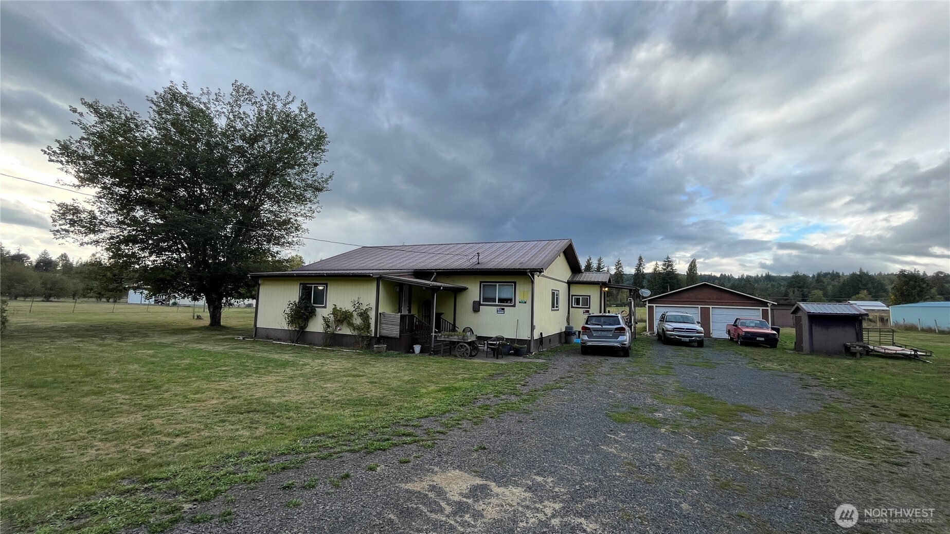 563 Shanklin Road Onalaska, WA 98570 - Photo 2 of 4 a view of a house with a big yard and large trees