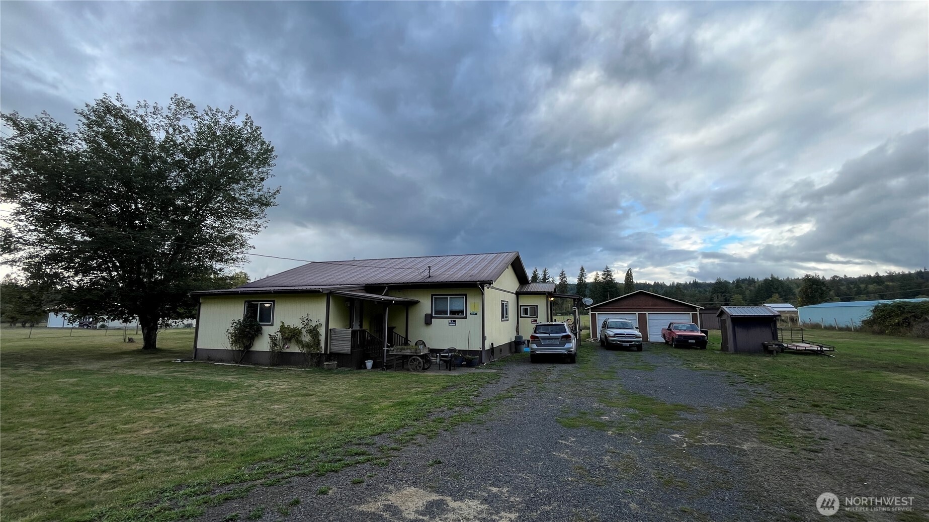 563 Shanklin Road Onalaska, WA 98570 - Photo 4 of 4 a view of a big house with a big yard and large trees