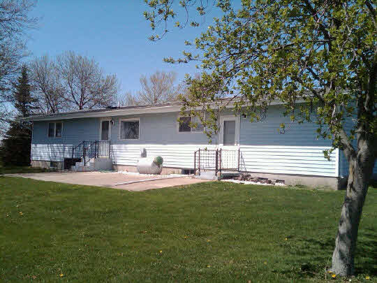 3311 Krupke Road Caledonia, IL 61011 - Photo 7 of 9 a front view of a house with patio and garden