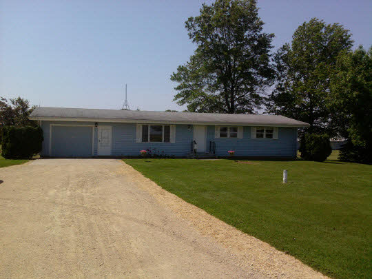 3311 Krupke Road Caledonia, IL 61011 - Photo 9 of 9 a front view of a house with a garden